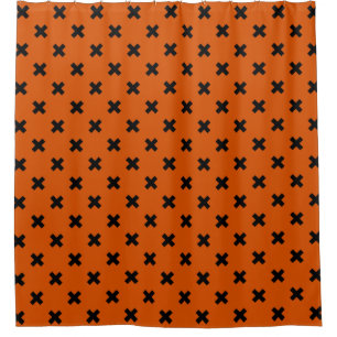 Black cross stitches on orange shower curtain