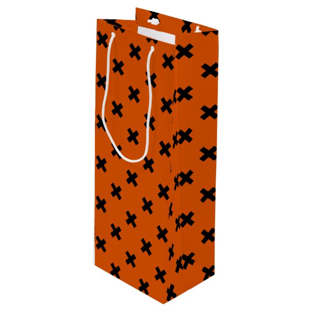 Black cross stitches on orange wine gift bag (Front Angled)