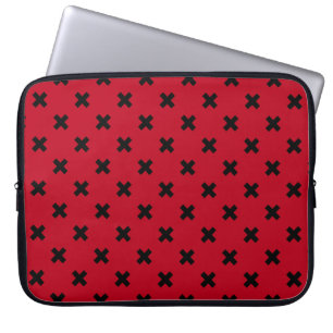 Black cross stitches on red laptop sleeve