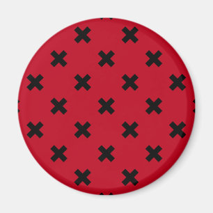 Black cross stitches on red magnet