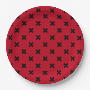 Black cross stitches on red paper plates
