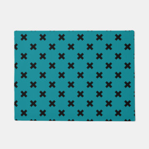 Black cross stitches on teal doormat