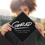 Black | Dashed Grad Graduation Cap Topper<br><div class="desc">Personalized graduation cap topper featuring "Grad" in white hand-lettering with a dashed underline with a black background or color of your choice. Personalize the custom graduation cap topper by adding the graduate's name and graduation year.</div>