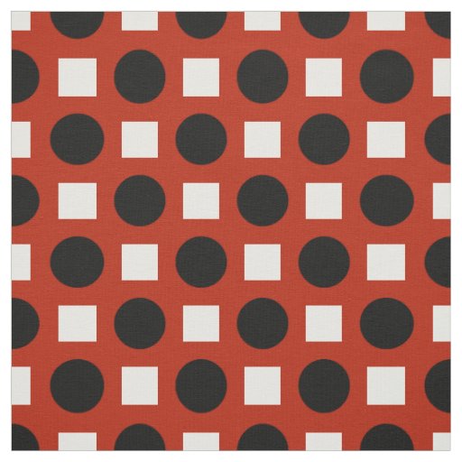 Black dots and white squares on red fabric