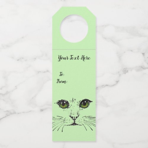 Black Drawing of Cat Face Long Whiskers Green eyes Bottle Hanger Tag