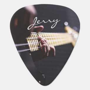 Black Electric Bass Guitar and Bassist Music Pick