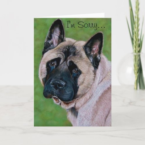 black faced dog with sad expression saying sorry card