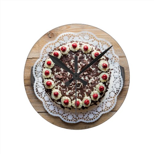 Black Forest cake on rustic wood Round Wall Clock