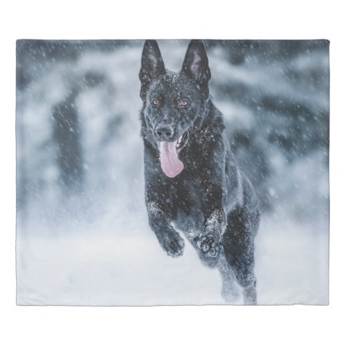 Black German Shepherd in snow Duvet Cover