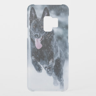 Black German Shepherd in snow Duvet Cover