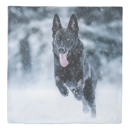 Black German Shepherd in snow Duvet Cover