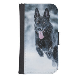 Black German Shepherd in snow Duvet Cover