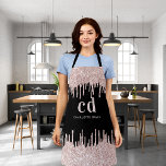 Black glitter drips rose gold monogram business apron<br><div class="desc">A black background decorated with rose gold,  pink sparkling faux glitter drips,  paint dripping look. Personalize and add your monogram initials and name. Modern block letters.</div>