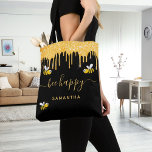 Black gold glitter bumblebees be happy name tote bag<br><div class="desc">Decorated with happy,  smiling bumblebees. A chic black background. Decorated with faux gold glitter drips. Yellow hand lettered script with swashes and the text: Bee Happy.  Personalize and add your name.</div>