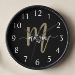 Black Gold Modern Script Monogram Name  Clock<br><div class="desc">Make a statement with the Black and Gold Modern Script Monogram Name Large Clock. Featuring a sleek black design with a bold gold monogram in a modern script font, this large wall clock combines luxury and functionality. With its elegant design, it seamlessly enhances any living room, office, or bedroom while...</div>
