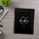 Black gold monogram initials name minimalist 2024 planner<br><div class="desc">Black background,  golden and white text. Personalize and add your name,  monogram initials,  and year. (any year) golden and white letters.  The name is written with a hand lettered style script.</div>