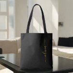 Black Gold Name White Girly Script Monogram Modern Tote Bag<br><div class="desc">Black and Gold Elegant Add Your Own Name Monogram Book Bag. This Book Bag can be customized to include your initial and first name and given as a gift for Christmas,  Sweet 16 Birthday,  Bridal Shower or a Wedding.</div>