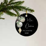 Black gold white baubles Christmas Ceramic Ornament<br><div class="desc">An elegant,  modern black background. Decorated with white and gold baubles and some greenery and a pine cone.  Personalize and add your name,  year.  Text: Merry Christmas</div>