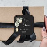 Black gold white baubles Christmas Square Sticker<br><div class="desc">For a Christmas party favors or gift wrapping. An elegant,  modern black background. Decorated with white and gold baubles and some greenery and a pine cone.  Personalize and add your name,  year.  Text: Merry Christmas</div>