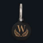 Black gold wreath monogram initial dog pet ID tag<br><div class="desc">A stylsih black background decorated with a classic wreath . Personalize and add the pet's monogram initial. Add your phone number on the back. Golden colored letters.</div>