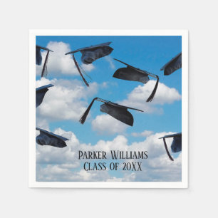 black graduation caps in sky paper napkins