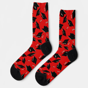 Black Graduation Caps Tossed in the Air on Red Socks