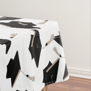 Black Graduation Caps Tossed in the Air on White Tablecloth