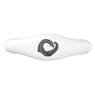 Black heart dragon on white ceramic drawer pull