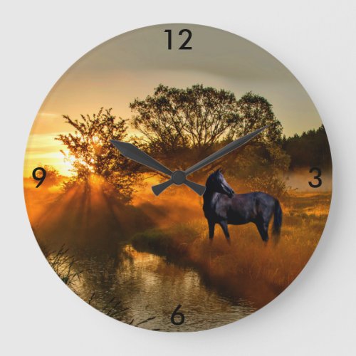 Black horse at sunrise or sunset large clock