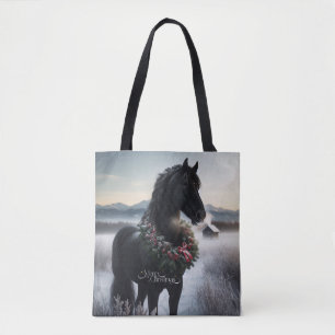 Black horse in the snow with Christmas wreath  Tote Bag