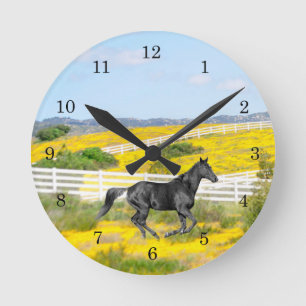 Black Horse Running in Field of Flowers Round Clock