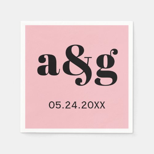 Black initials typography on pink wedding napkins