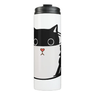Black kitten with red nose hiding in a cup
