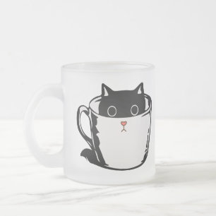 Black kitten with red nose hiding in a cup