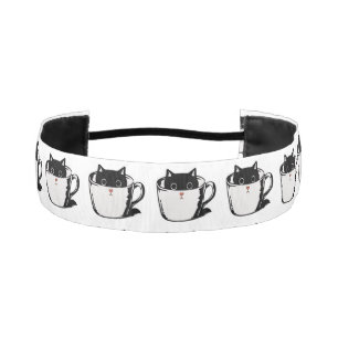 Black kitten with red nose hiding in a cup athletic headband