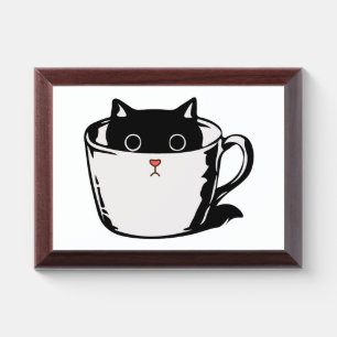 Black kitten with red nose hiding in a cup award plaque