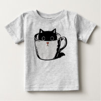 Black kitten with red nose hiding in a cup