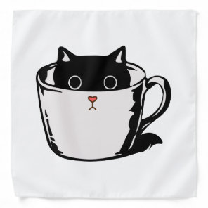 Black kitten with red nose hiding in a cup bandana