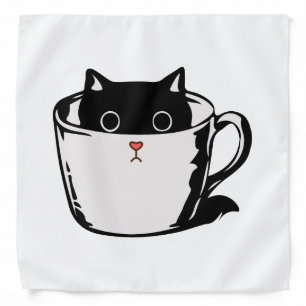 Black kitten with red nose hiding in a cup bandana