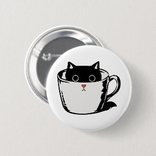 Black kitten with red nose hiding in a cup button
