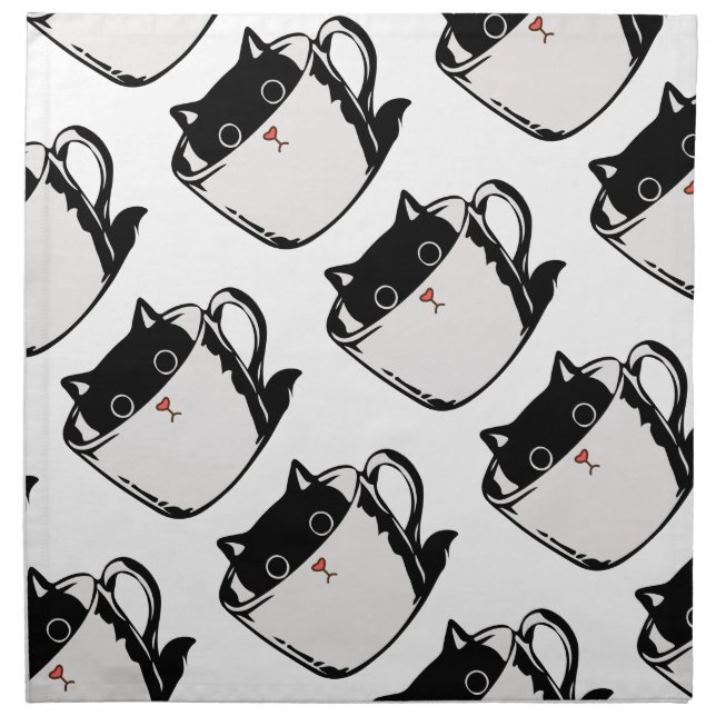 Black kitten with red nose hiding in a cup cloth napkin (Front)