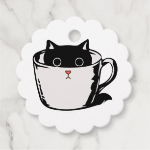 Black kitten with red nose hiding in a cup favor tags