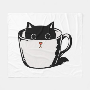 Black kitten with red nose hiding in a cup fleece blanket