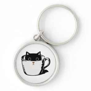 Black kitten with red nose hiding in a cup keychain