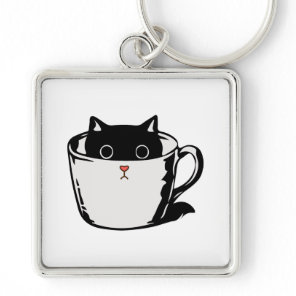 Black kitten with red nose hiding in a cup keychain