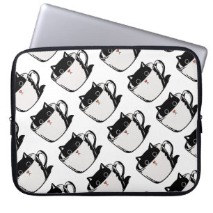 Black kitten with red nose hiding in a cup laptop sleeve