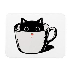 Black kitten with red nose hiding in a cup magnet