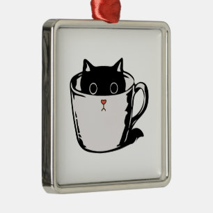 Black kitten with red nose hiding in a cup metal ornament
