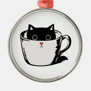 Black kitten with red nose hiding in a cup metal ornament