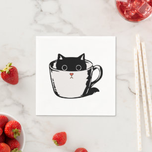 Black kitten with red nose hiding in a cup napkins